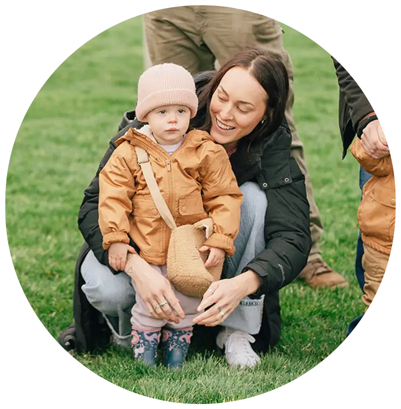 A mom and her toddler on the lawn at VRL